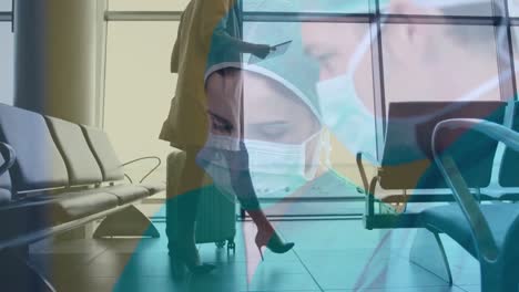 Animation-of-caucasian-female-and-male-surgeons-over-businesswoman-with-suitcase-at-airport