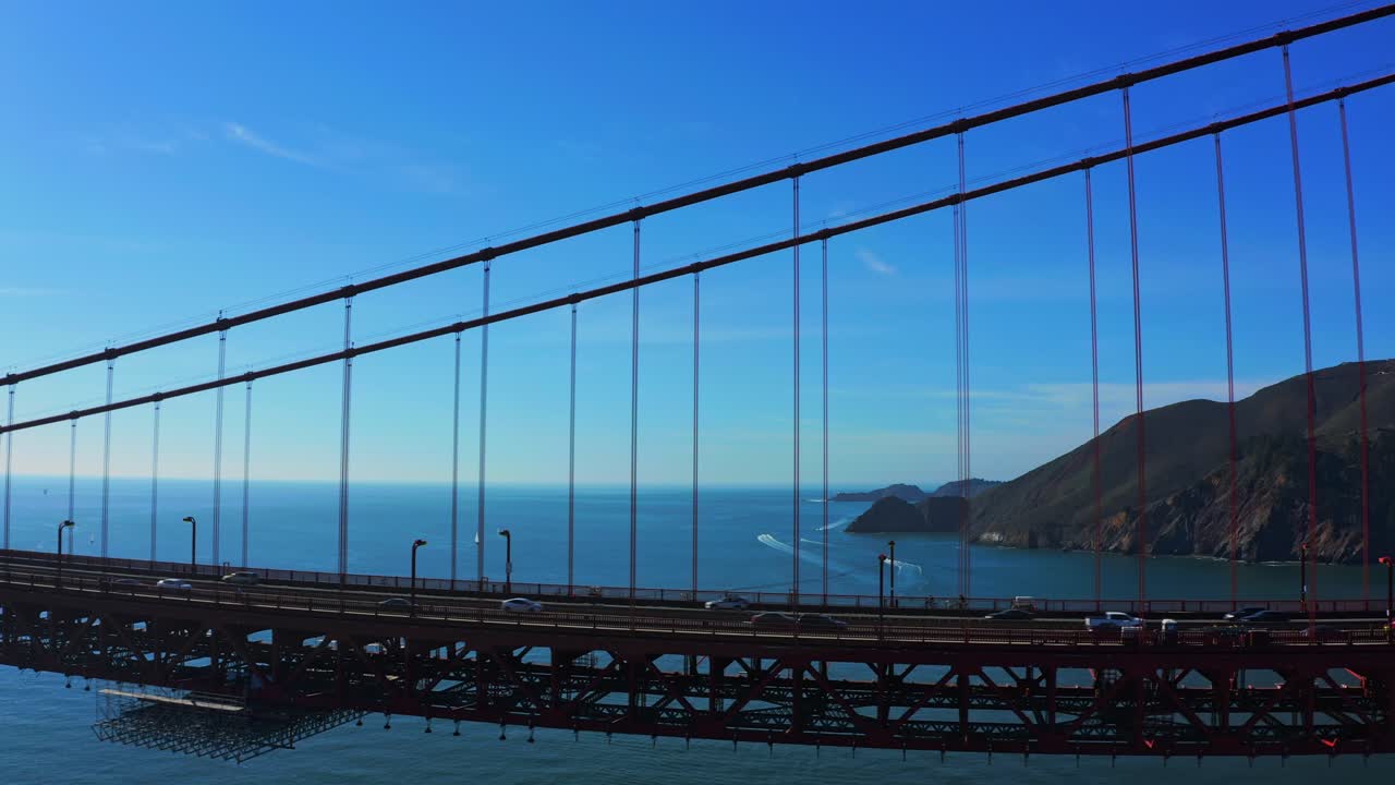 Vehicles driving along the Golden Gate Bridge.