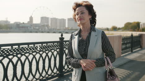 senior woman walking in city park