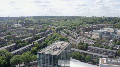 London-aerial-rises-over-building-to-reveal-green-Archway-district