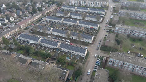 aerial overview of residential neighbourhood with solar panels on rooftop