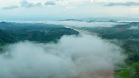 Drone-view-fly-through-the-cloud-on-mountains-of-Dak-Ha-town,-Kon-Tum-province,-central-highlands-Vietnam