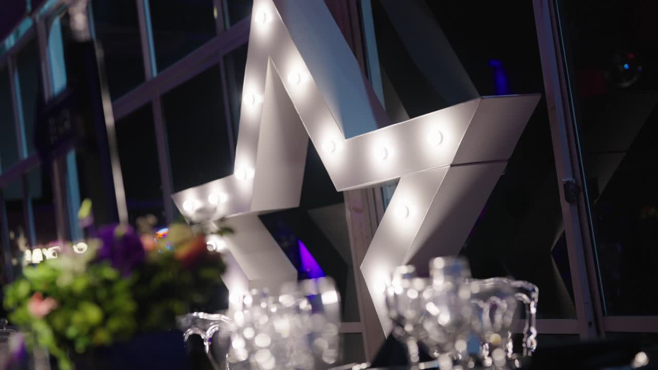 Illuminating star decoration glowing softly in elegant evening event interior