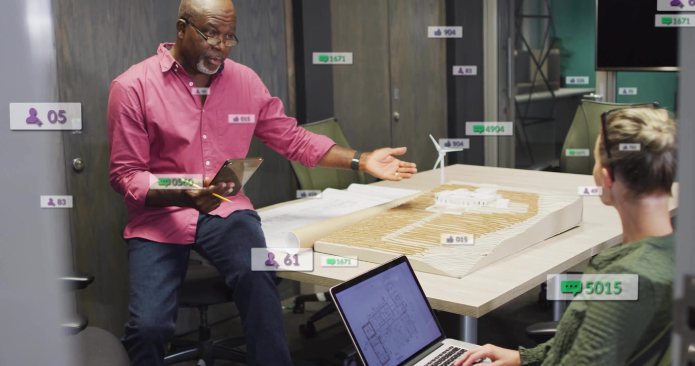 Lead, designer gesturing, typing; camera panning glass revealing turbine model overlays for design