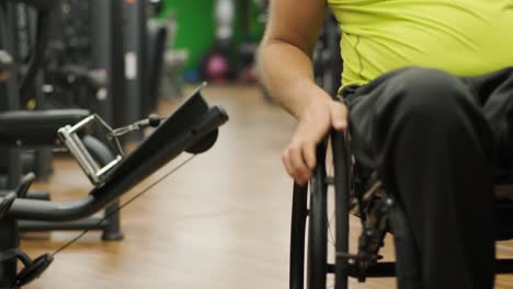 man with disabilities training in the gym of rehabilitation center