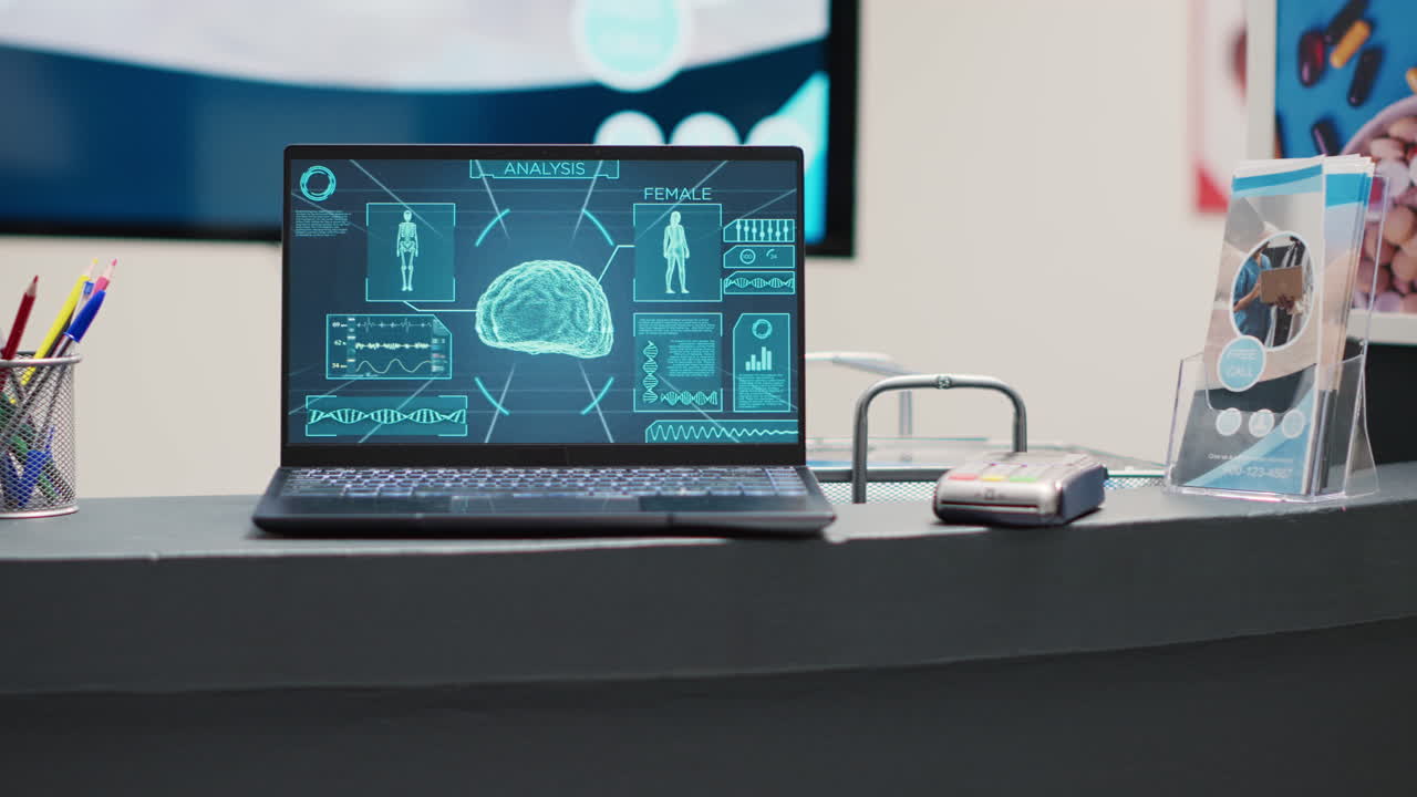 Laptop with brain x ray scan on counter