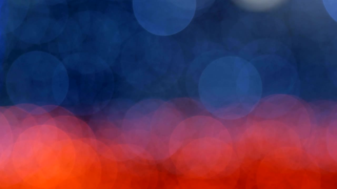 Night abstract background is defocused with nice bokeh. Blurred Christmas Lights Bokeh. Pan across blur .