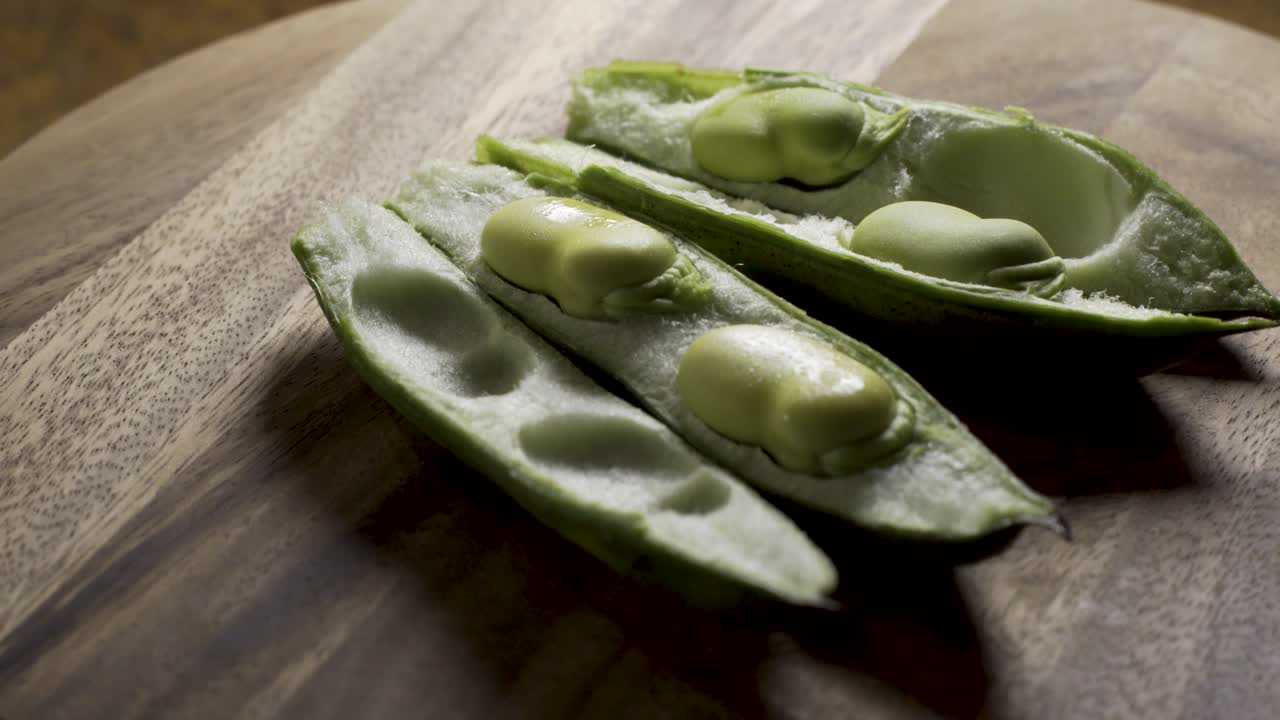 Fresh Fava Beans on Wooden Board