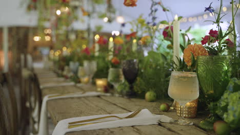 beautifully decorated long banquet table with fairytale theme, plants and flowers for wedding