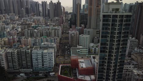 a panning downward reveal drone shot in hong kong