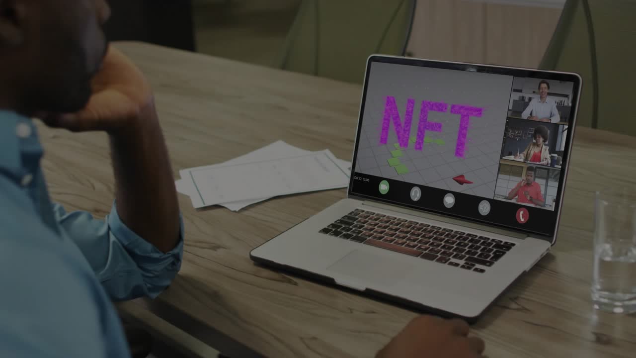 Seated man monitoring screen while host starting NFT charts on screen with code overlay for review