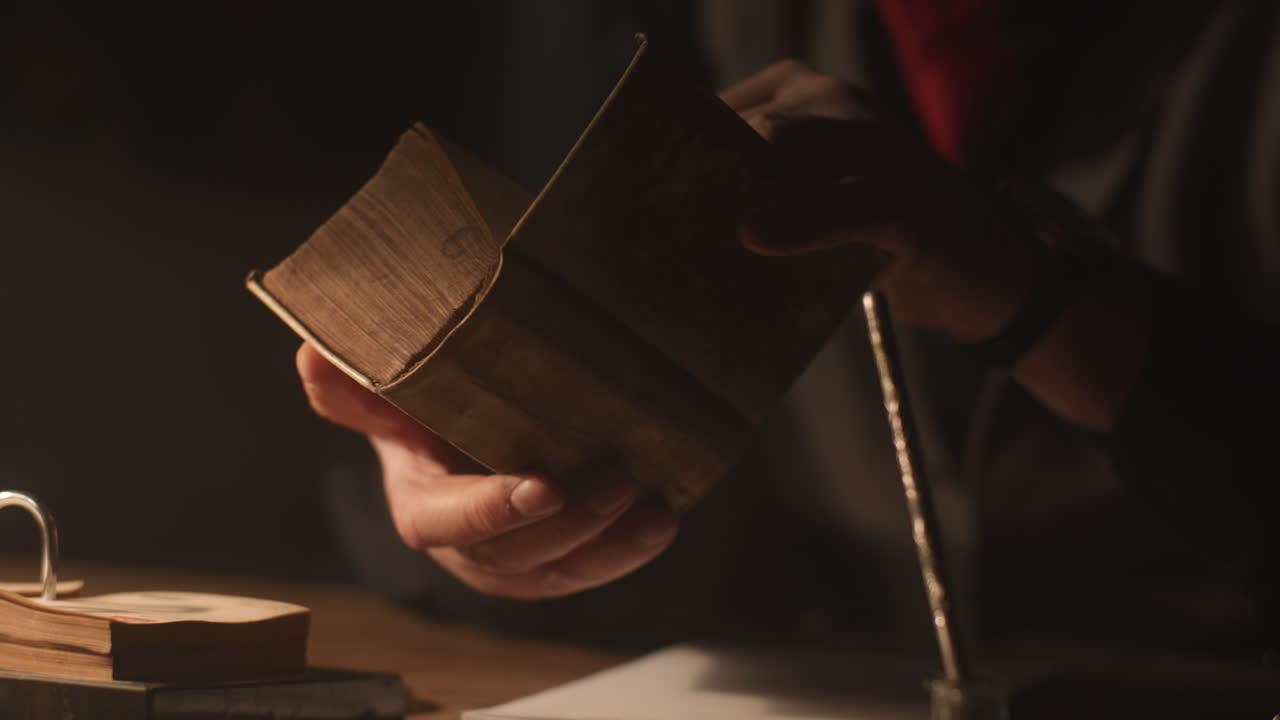 Old passionate man read a book in his office at night