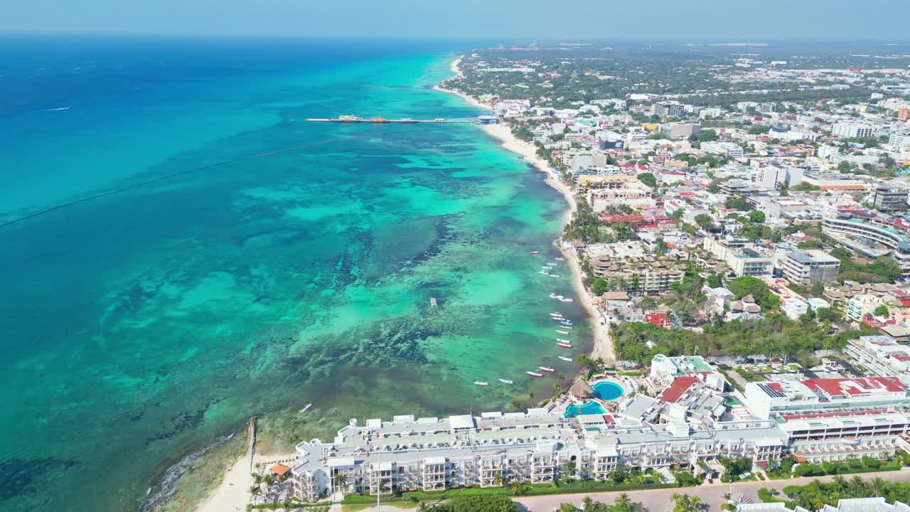 Tropical playa del carmen beach with turquoise sea and cityscape, aerial view