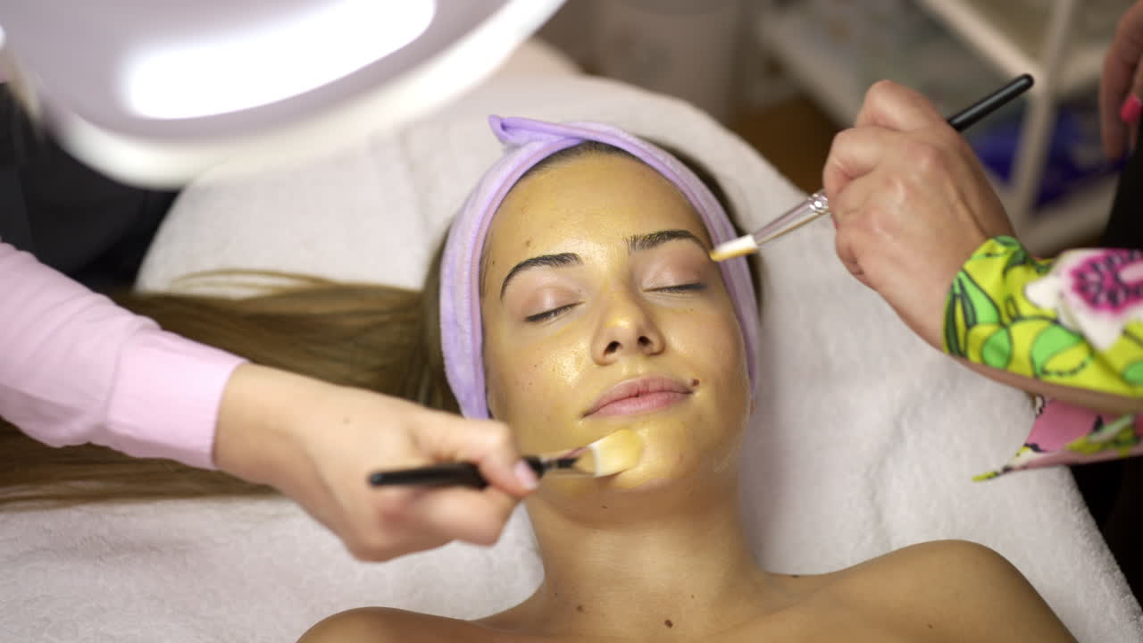 Woman receives a relaxing facial treatment at a beauty salon