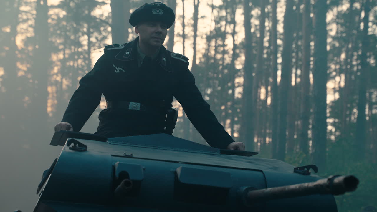 German Officer on Tank in a Forest During WWII