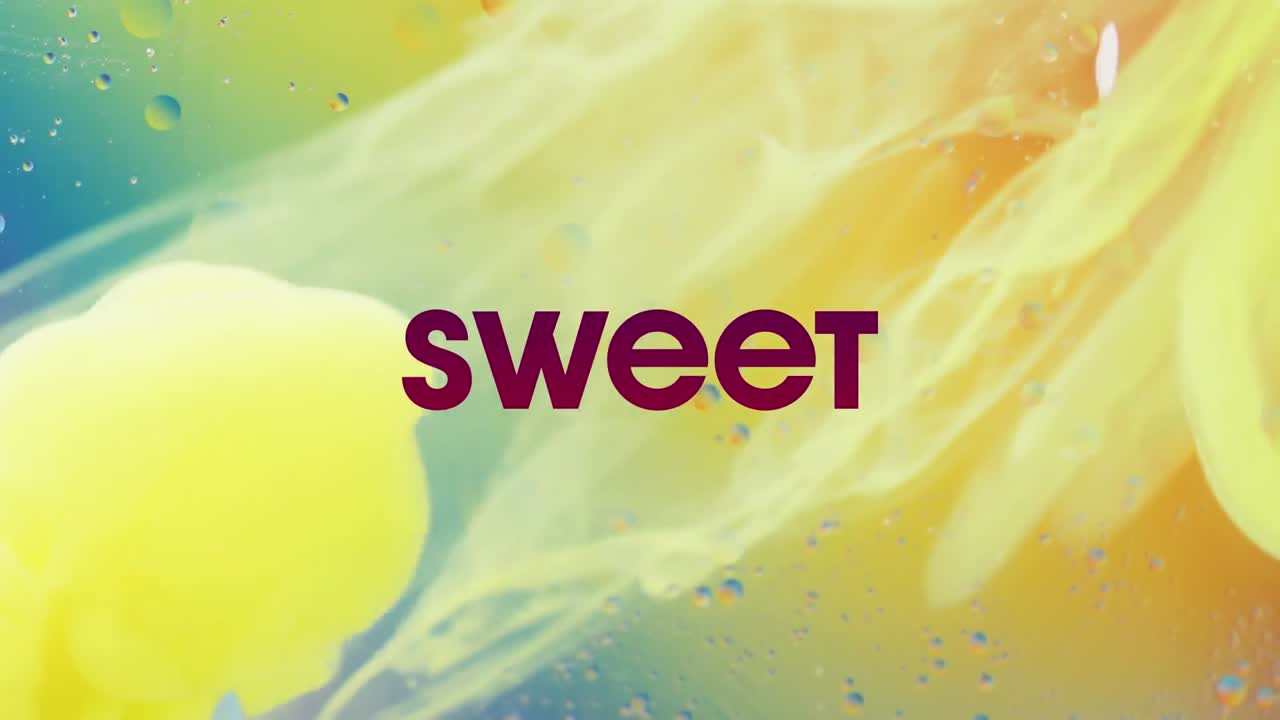 Animation of sweet text over close up of liquid and baubles