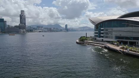 aerial of the hong kong convention and exhibition centre and city skyline, wan chai, hong kong, china