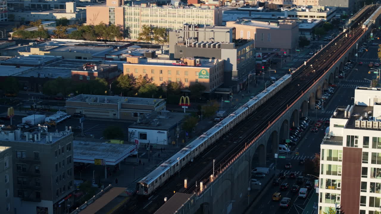 Establishing shot of a New York City subway train in Queens. Shot on an Autumn morning in 4k.