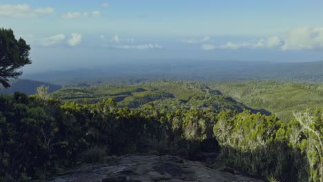 panoramic establishing pan from kilimanjaro with clouds and vast valley landscape below
