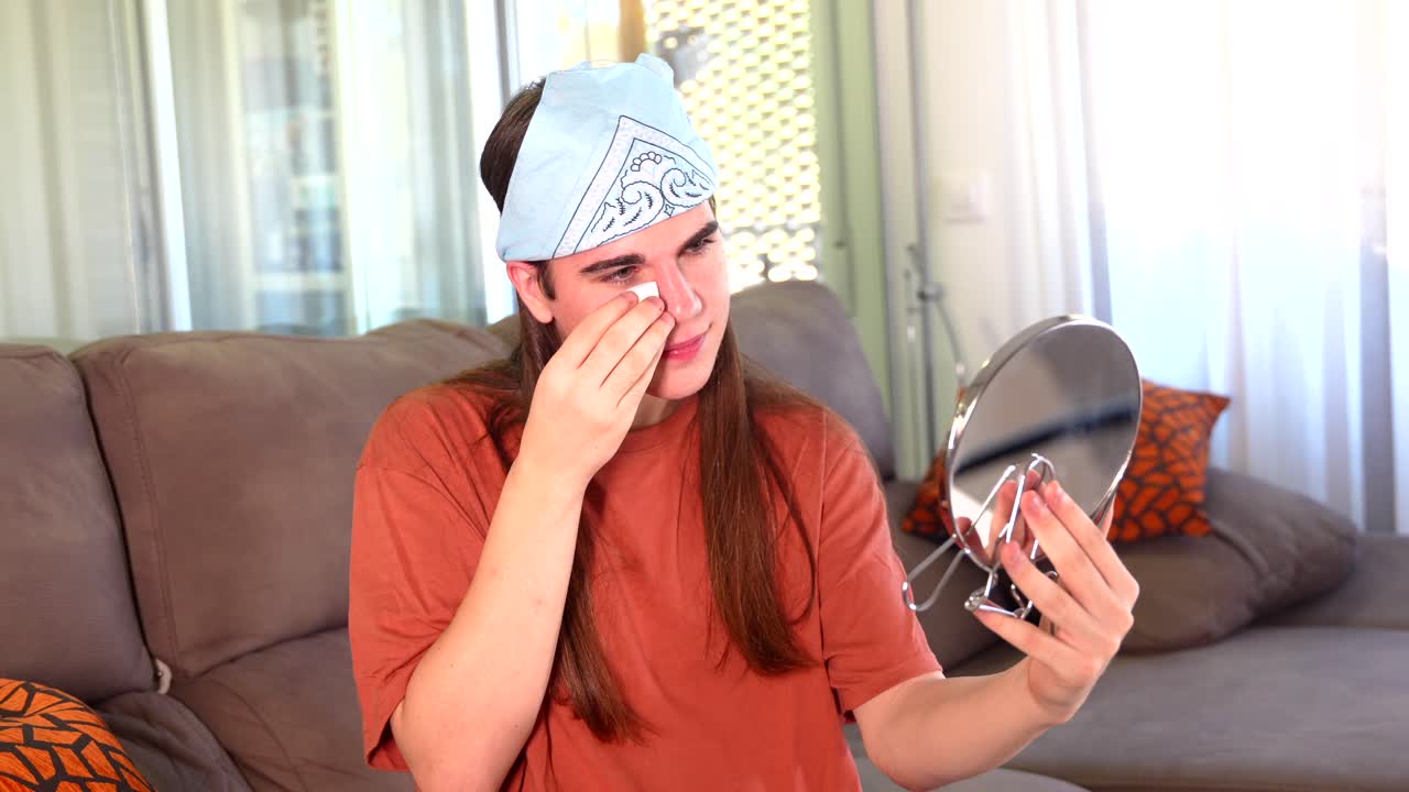 Person Applying Makeup in Home Setting