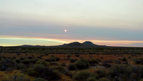 aproaching distant mountains as the sun rises through the smoky haze from california wildfires