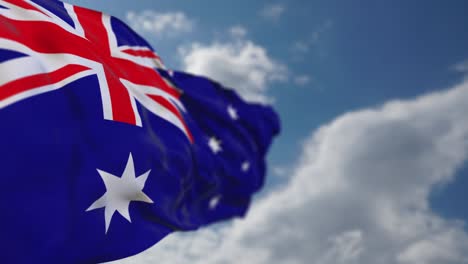 waving autralia flag in cloudy sky.