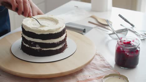 woman making chocolate cake in kitchen, close-up. female hands close up. cake making process, selective focus