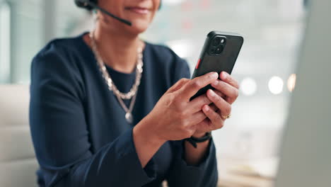 woman using smartphone in office