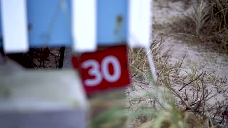 door sign number 30 getting into focus at a house at the danish beach, slow motion