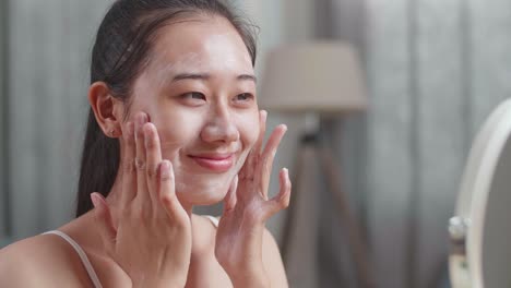 woman applying face wash