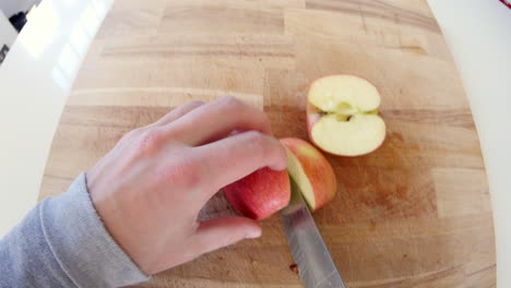 point of view of man chopping up an apple