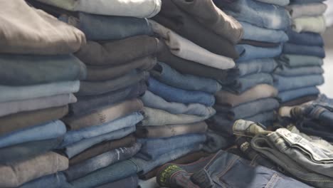 stacks of folded jeans