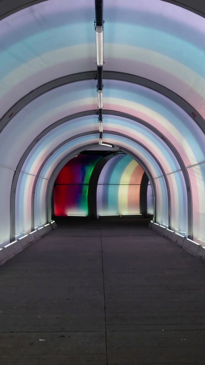 Vertical video: Arched tunnel cycling timed LED panels, overhead tubes, base strips for public art