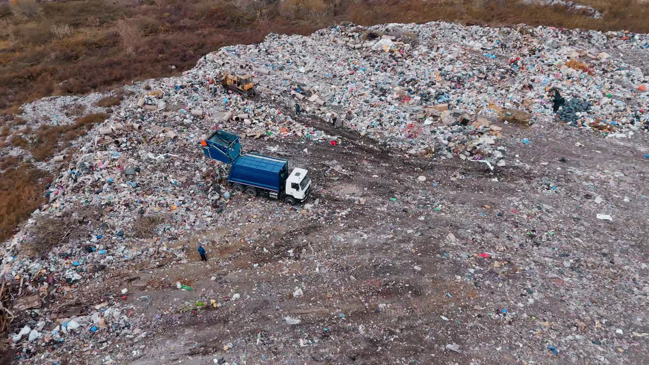 Aerial View of a Landfill with Garbage Truck