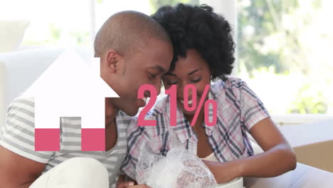 animation of house icon and percent in pink over diverse couple moving in unpacking boxes