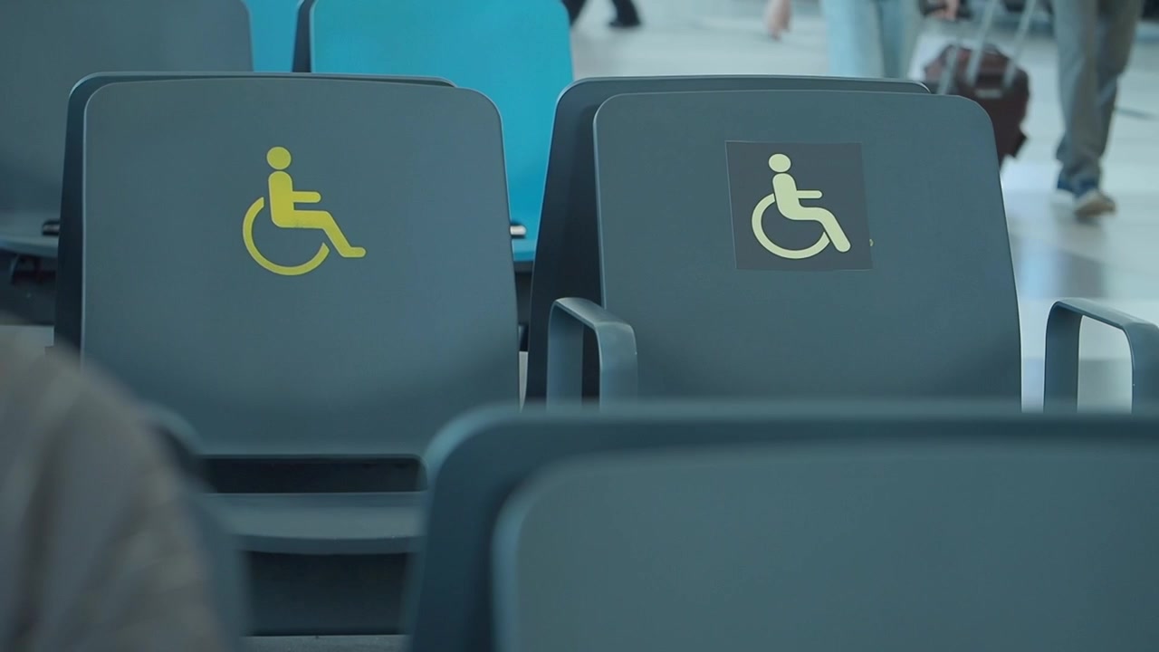Accessible Seating Area with Wheelchair Symbols in Airport Terminal