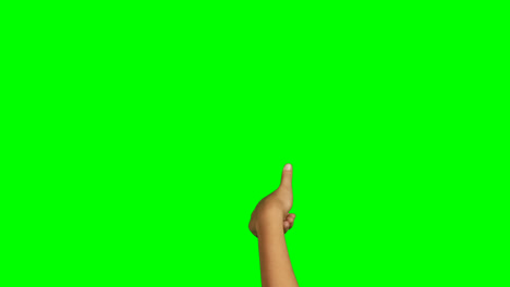 persona haciendo un gesto de la mano contra el fondo de la pantalla verde