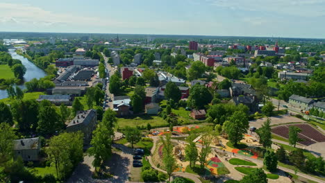 aerial view of colorful park and playground near river in jelgava, latvia