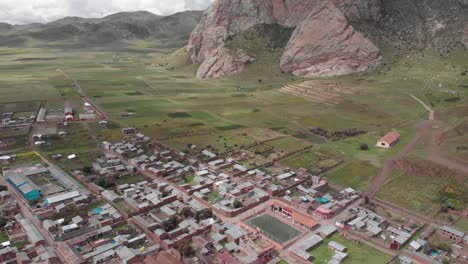 aerial flyover of st isabel church to farms outside pucara, peru