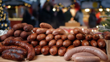 a variety of sausages on display at a festive market