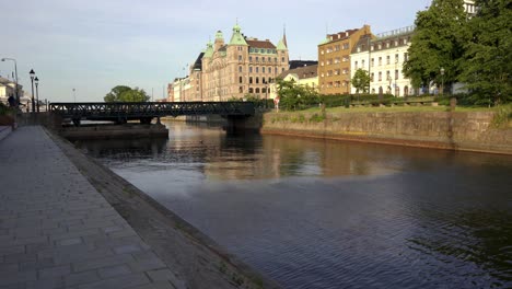 malmo, view from a canal looking at the cityscape and historic buildings in the city center