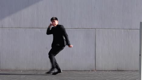 businessman performing breakdance in street