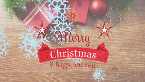 Animation-of-merry-christmas-and-happy-new-year-text-over-decorations-on-wooden-background