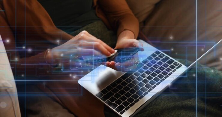 Animation of empty interface screens and data processing over woman with laptop cleaning smartphone