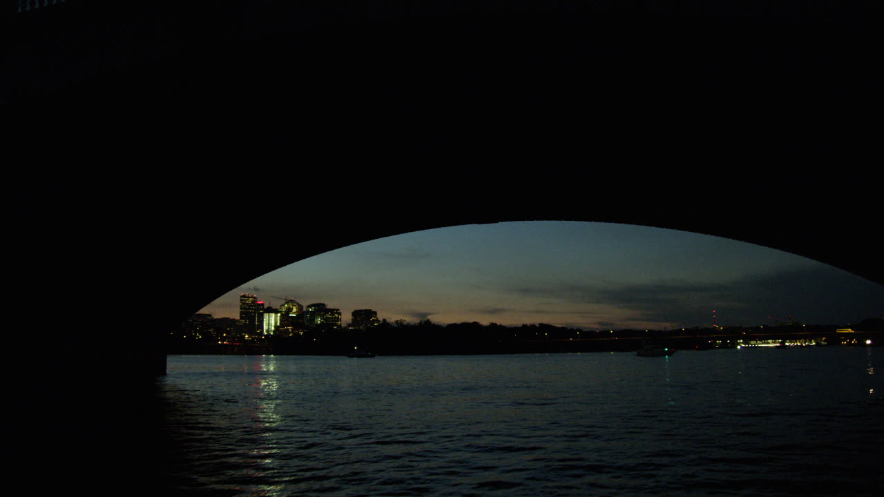 Potomac river going under a bridge at sunrise.