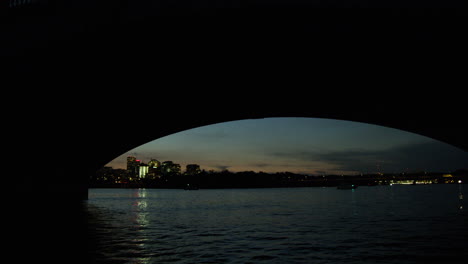 potomac river going under a bridge at sunrise.