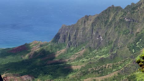 close up of na pali coast from kalalau lookout on kauai with moving cloud shadow
