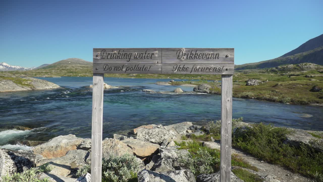 Drinking Water, Do Not Pollute In English And Norwegian Public Sign For Hikers - Notice To Protect A Natural Water Source In Norway. - static shot