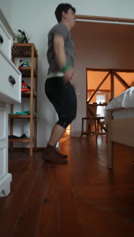 man jumping jacks at home