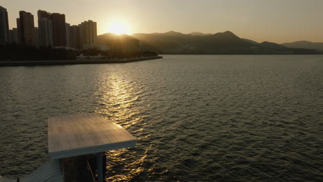 Drone-view-of-tall-buildings-and-the-waterfront-in-Hong-Kong,-China